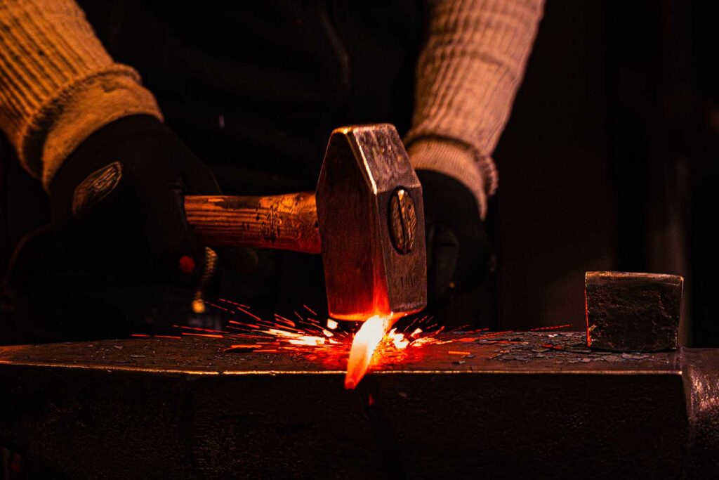 a blacksmith forging metal