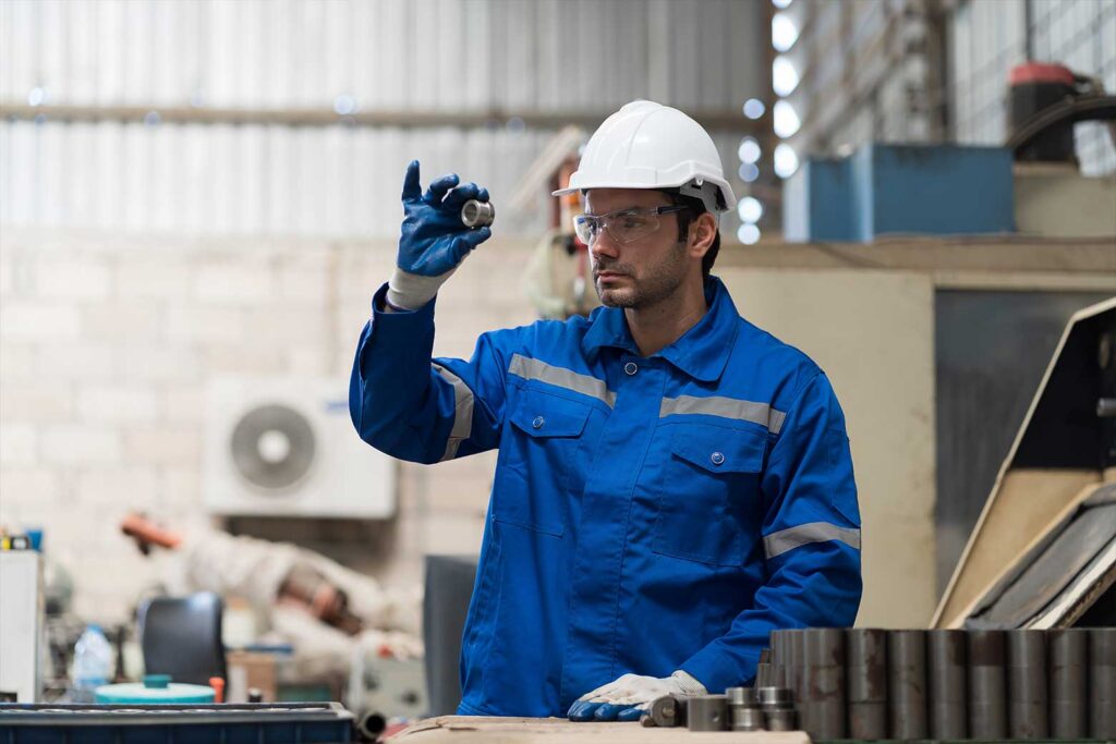 factory worker inspecting product