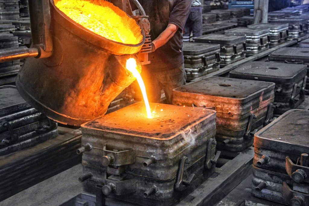 molten metal being poured to manufacture finished goods