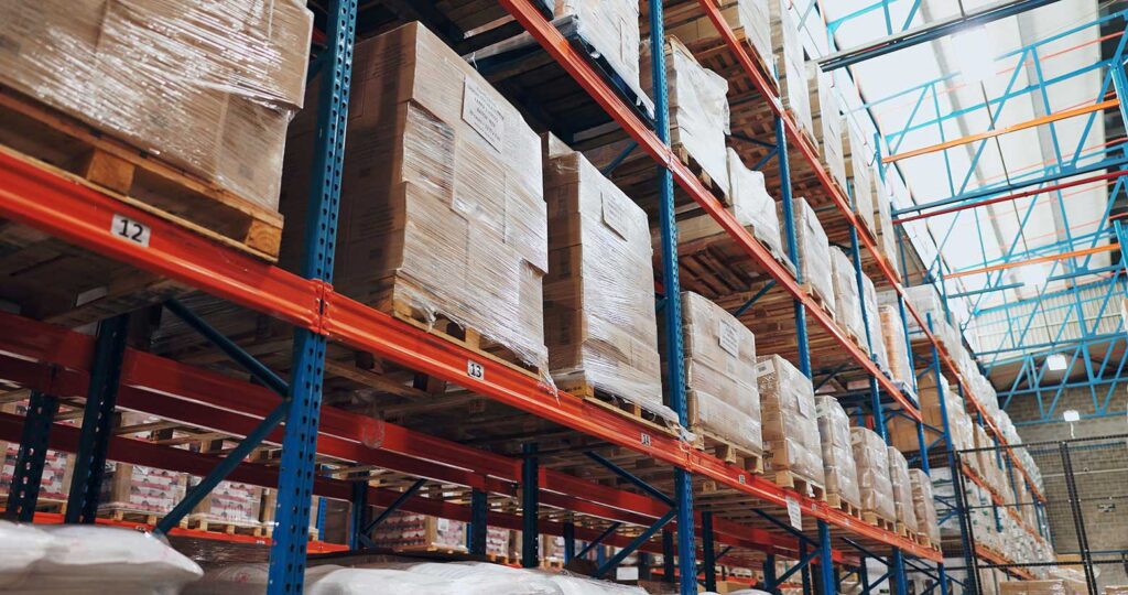 pallets stacked on shelves in a warehouse