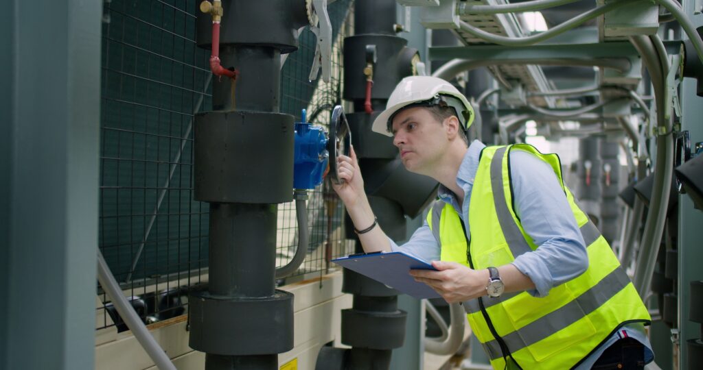 an inspector reviewing equipment